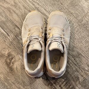 On Running Beige and White Athletic Shoes